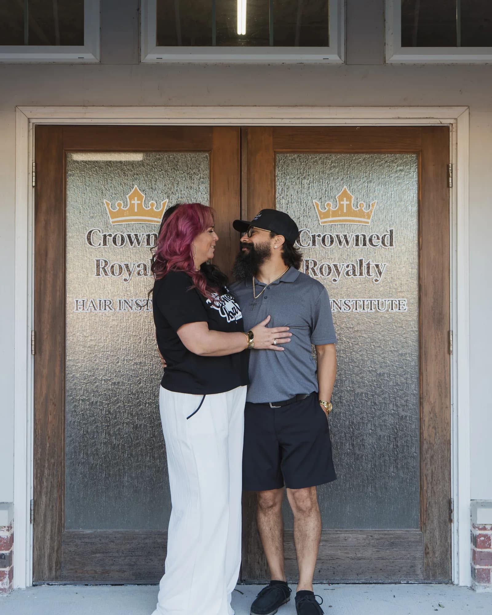 Jessica and Daniel Saragosa at the Crowned Royalty Hair Institute entrance